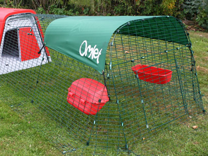 Image of chickens using the feeder and drinker