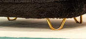 Une image en gros plan de Gold hair pin customisable feet on donut cat bed