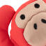Gros plan sur un jouet pour chien de type singe rouge Gros plan sur un jouet pour chien de type singe rouge