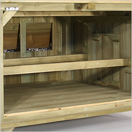 Inside of a Lenham chicken coop showing nesting box and perches.